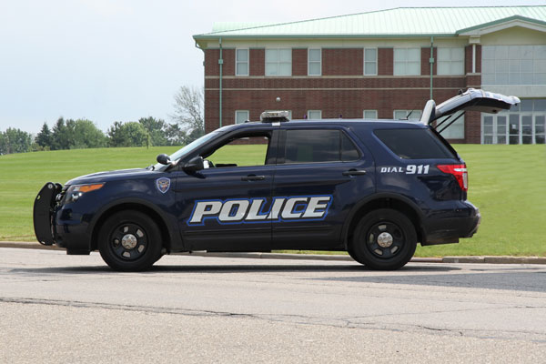 Image of police SUV with back hatch open representing location of ARAM Mobile, radiation detection systems that can be deployed in law enforcement vehicles for PRND. 